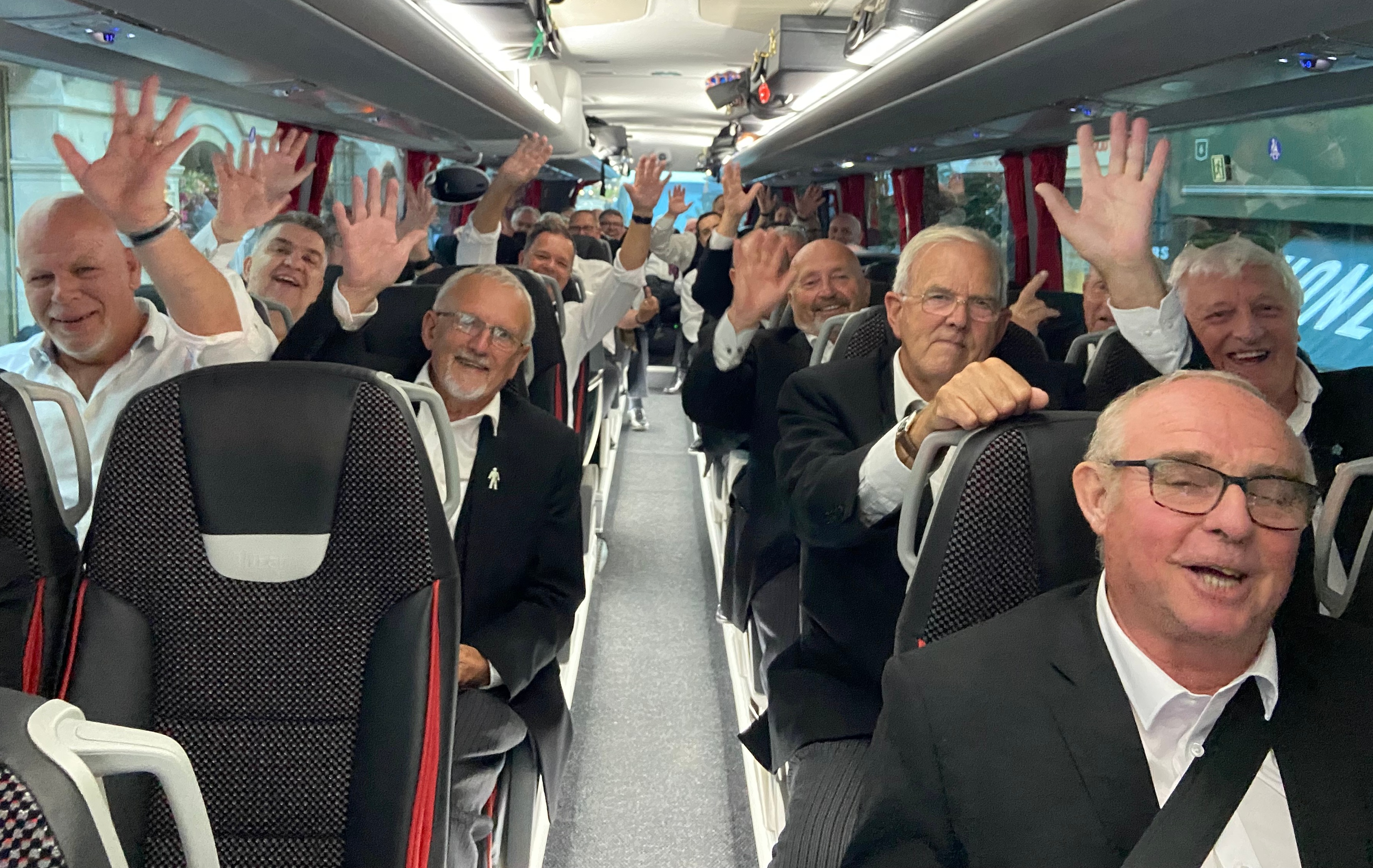 The Hampshire and Isle of Wight party waving from the coach after the Craft AGM in London