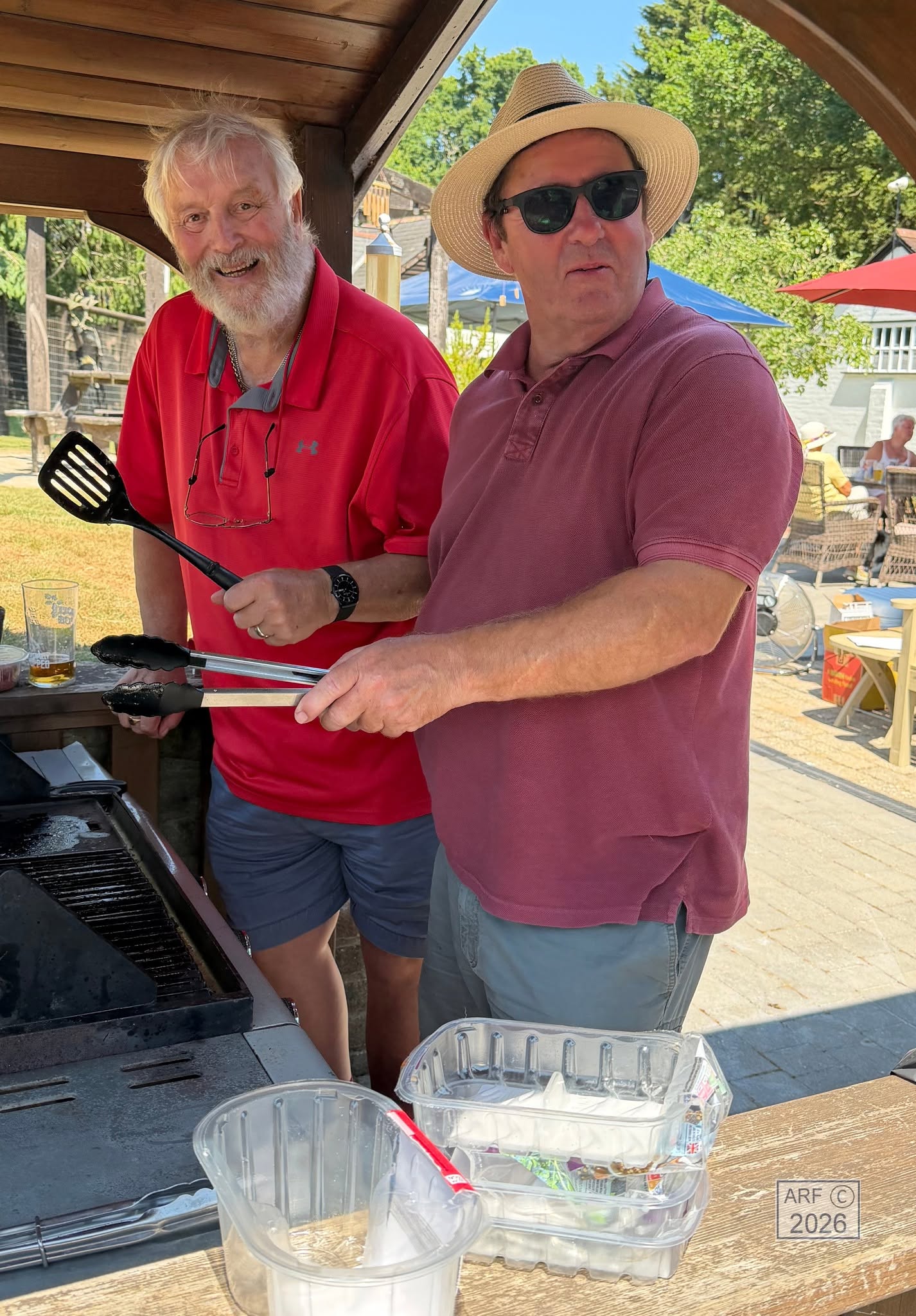 The chef and his helper at the barbecue