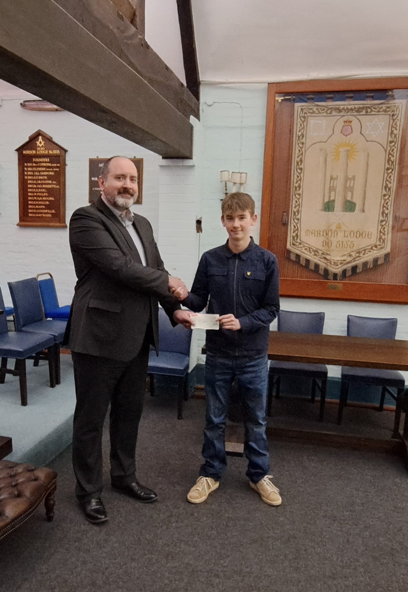 A cheque presentation from Merdon Lodge to King’s School